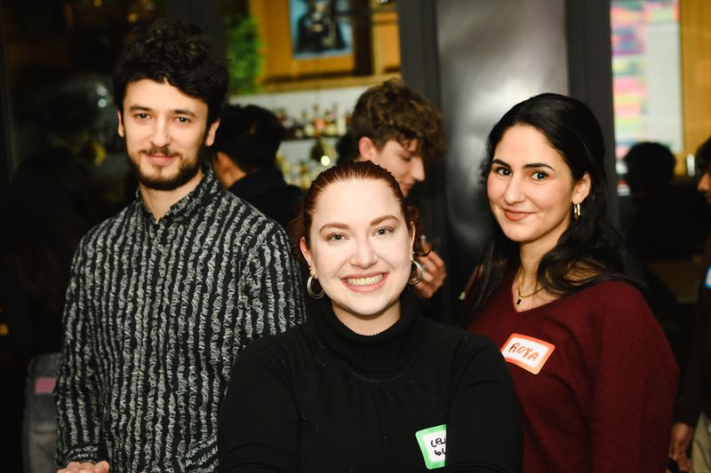 Three guests smiling at the camera